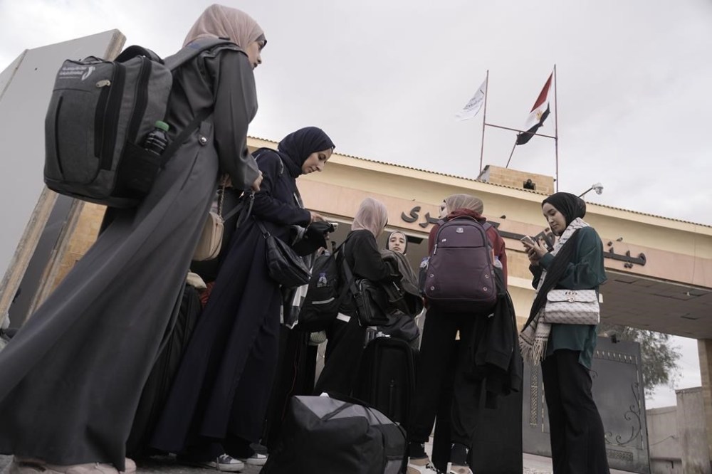 More than 450 people with ties to Canada have now managed to escape the Palestinian territory where Israel is waging war against Hamas. Evacuated Palestinians with Canadian passports from Gaza, are photographed at the Rafah Border Crossing, Egypt, Sunday, Nov. 19, 2023. THE CANADIAN PRESS/AP-Amr Nabil
