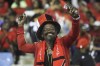 A Trinidad and Tobago supporter cheers during the CONCACAF Nations League quarterfinal match against the United States at the Hasely Crawford Stadium in Port of Spain, Trinidad and Tobago, Monday, Nov. 20, 2023. (AP Photo/Azlan Mohammed)