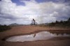 A youth rides a bicycle through the village of Wowetta, located in the Essequibo, Guayana, Saturday, Nov. 18, 2023. Venezuela has long claimed Guyana’s Essequibo region — a territory larger than Greece and rich in oil and minerals. (AP Photo/Juan Pablo Arraez)
