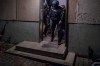 Police officers leave a house during a raid in the early hours of the morning in Munich, Germany, Tuesday, Nov. 21, 2023. German authorities have raided the premises of 17 people in Bavaria accused of spreading antisemitic hate speech and threats to Jews online. Bavarian criminal police said Tuesday the suspects were two women and fifteen men aged between 18 and 62. German news agency dpa reported that police questioned the suspects and confiscated evidence from their homes, including cell phones and laptops. (Peter Kneffel/dpa via AP)