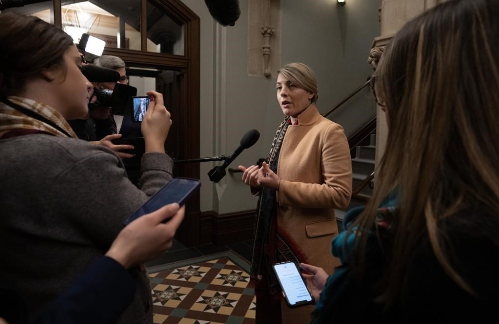 Minister of Foreign Affairs Melanie Joly speaks with media before attending cabinet meeting on Parliament Hill, Tuesday, Nov. 21, 2023 in Ottawa. THE CANADIAN PRESS/Adrian Wyld