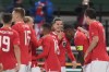 Austria's Marcel Sabitzer, center, celebrates with teammates after scoring the opening goal during the international friendly soccer match between Austria and Germany at the Ernst Happel stadium in Vienna, Austria, Tuesday, Nov. 21, 2023. (AP Photo/Matthias Schrader)
