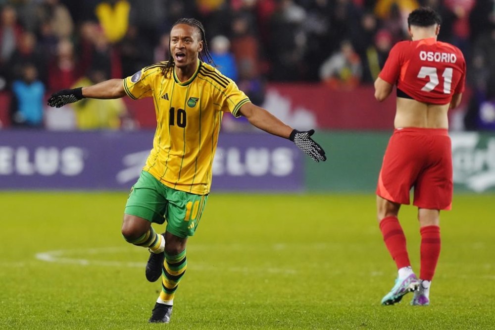 Jamaica's Bobby Reid (10) celebrates after defeating Canada as Jonathan Osorio (21) reacts following CONCACAF Nations League quarterfinal soccer action in Toronto on Tuesday, November 21, 2023. THE CANADIAN PRESS/Chris Young