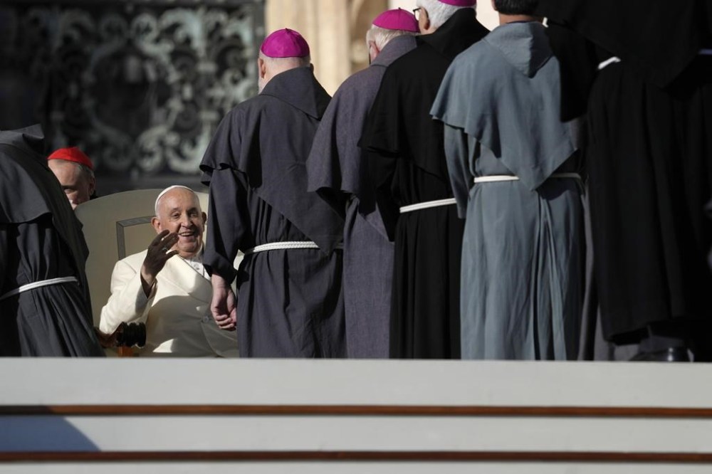 Pope Francis smiles as he meets prelates during his weekly general audience in St. Peter's Square, at the Vatican, Wednesday, Nov. 22, 2023. (AP Photo/Andrew Medichini)