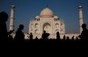 Indian and foreign tourists mingle outside the Taj Mahal, in Agra, India, Sunday, March 24, 2019. Immigration Minister Marc Miller says he's happy to hear India is restoring electronic visa services for Canadians after two months of diplomatic tensions between the two countries. THE CANADIAN PRESS/AP-Manish Swarup