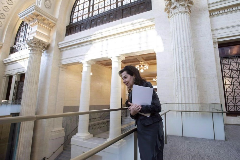 Senator Raymonde Saint-Germain looks into the Main Hall at the Senate of Canada Building, formerly the Government Conference Centre, is shown in Ottawa on Thursday, Dec. 13, 2018. THE CANADIAN PRESS/Justin Tang