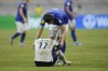 Uzbekistan's Azizbek Tulkunbekov, top, comforts England's Joel Ndala after Uzbekistan defeated England in their FIFA U-17 World Cup round of 16 soccer match at Jakarta International Stadium in Jakarta, Indonesia, Wednesday, Nov. 22, 2023. (AP Photo/Dita Alangkara)