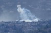 A shell that appears to be white phosphorus from Israeli artillery explodes over Kfar Kila, a Lebanese border village with Israel, as it seen from Marjayoun town in south Lebanon, Wednesday, Nov. 22, 2023. (AP Photo/Hussein Malla)