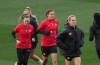 Canada's Christine Sinclair ,centre, and Sophie Schmidt, right, run during a training session at the FIFA Women's World Cup in Melbourne, Australia, Sunday, July 30, 2023. Captain Sinclair won't be the only player in the spotlight when Canada hosts Australia in Victoria and Vancouver next month. Veteran goalkeeper Erin McLeod and midfielder Schmidt, who have also called time on their international career, are also being honoured at the Vancouver game. THE CANADIAN PRESS/Scott Barbour