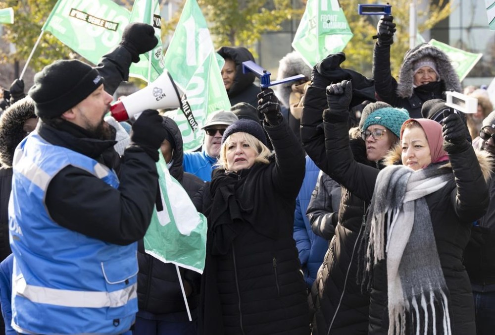 Quebec Premier François Legault says he's ready to augment his offer to striking public sector workers, but he says their unions have to show more flexibility. Quebec health and social service workers strike outside the CHUM hospital in Montreal, Tuesday, Nov. 21, 2023. THE CANADIAN PRESS/Christinne Muschi
