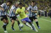 Brazil's Rodrygo, center, is challenged by Argentina's Giovani Lo Celso, right, and Rodrigo De Paul during a qualifying soccer match for the FIFA World Cup 2026 at Maracana stadium in Rio de Janeiro, Brazil, Tuesday, Nov. 21, 2023. (AP Photo/Bruna Prado)