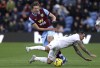 Burnley's Sander Berge and West Ham United's Danny Ings, right, vie for the ball during the English Premier League match between Burnley and West Ham United at Turf Moor, in Burnley, England. Saturday, Nov. 25, 2023. (Ian Hodgson/PA via AP)