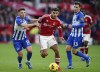 Nottingham Forest's Morgan Gibbs-White, centre, vies for the ball with Brighton and Hove Albion's Billy Gilmour, left, during the English Premier League soccer match between Nottingham Forest and Brighton & Hove Albion, in Nottingham, England, Saturday, Nov. 25, 2023. (Nick Potts/PA via AP)