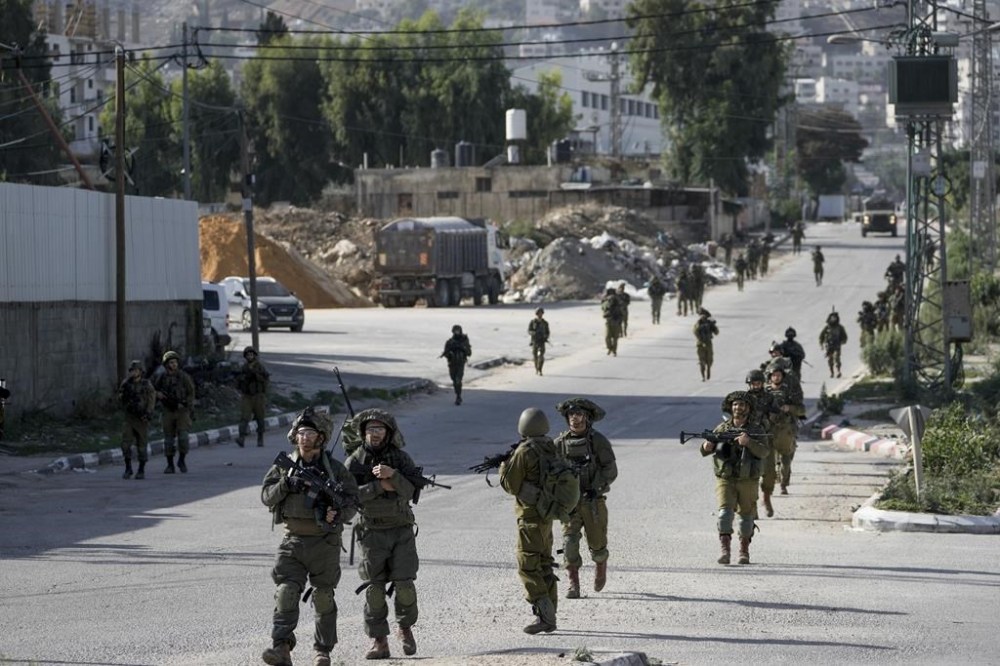 FILE - Israeli soldiers are seen in Balata, a Palestinian refugee camp in Nablus, West Bank, on Thursday, Nov. 23, 2023. Israeli forces operating in the occupied West Bank killed several Palestinians in a 24-hour period, Palestinian health officials said Sunday, Nov. 26, as a fragile pause in fighting between Israel and Hamas in the Gaza Strip entered its third day.(AP Photo/Majdi Mohammed, File)