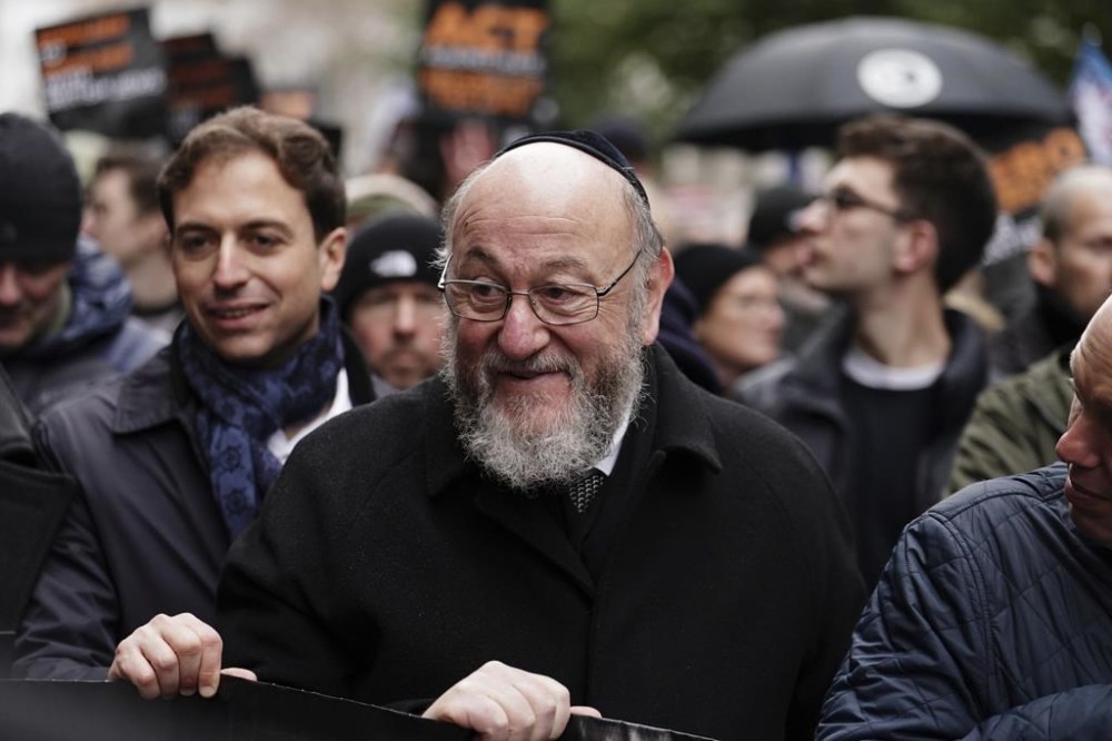Chief Rabbi Mirvis takes part in a march against antisemitism organised by the volunteer-led charity Campaign Against Antisemitism at the Royal Courts of Justice in London, Sunday, Nov. 26, 2023. (Jordan Pettitt/PA via AP)