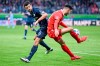 Bochum's Anthony Losilla, left, and Heidenheim's Tim Kleindienst, right, challenge for the ball during the German Bundesliga soccer match between 1. FC Heidenheim and VfL Bochum in Heidenheim, Germany, Sunday, Nov. 26, 2023. (Harry Langer/dpa via AP)