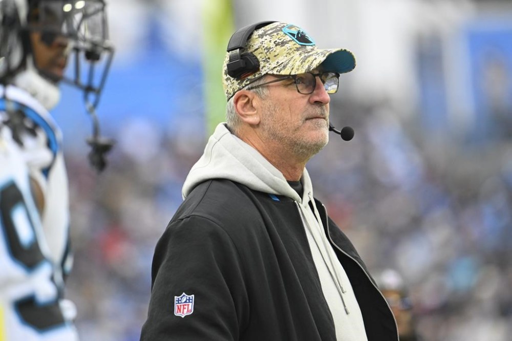 Carolina Panthers head coach Frank Reich watches from the sideline during the first half of an NFL football game against the Tennessee Titans Sunday, Nov. 26, 2023, in Nashville, Tenn. (AP Photo/John Amis)