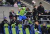 Seattle Sounders defender Nouhou Tolo, left, jumps up for the ball against Los Angeles FC midfielder Ryan Hollingshead, right, during the first half of an MLS conference semifinal playoff soccer match Sunday, Nov. 26, 2023, in Seattle. (AP Photo/Lindsey Wasson)