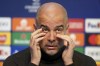Manchester City manager Pep Guardiola reacts during a press conference at the City Football Academy in Manchester, England, Monday Nov. 27, 2023, ahead of their Champions League match vs Leipzig. (Martin Rickett/PA via AP)