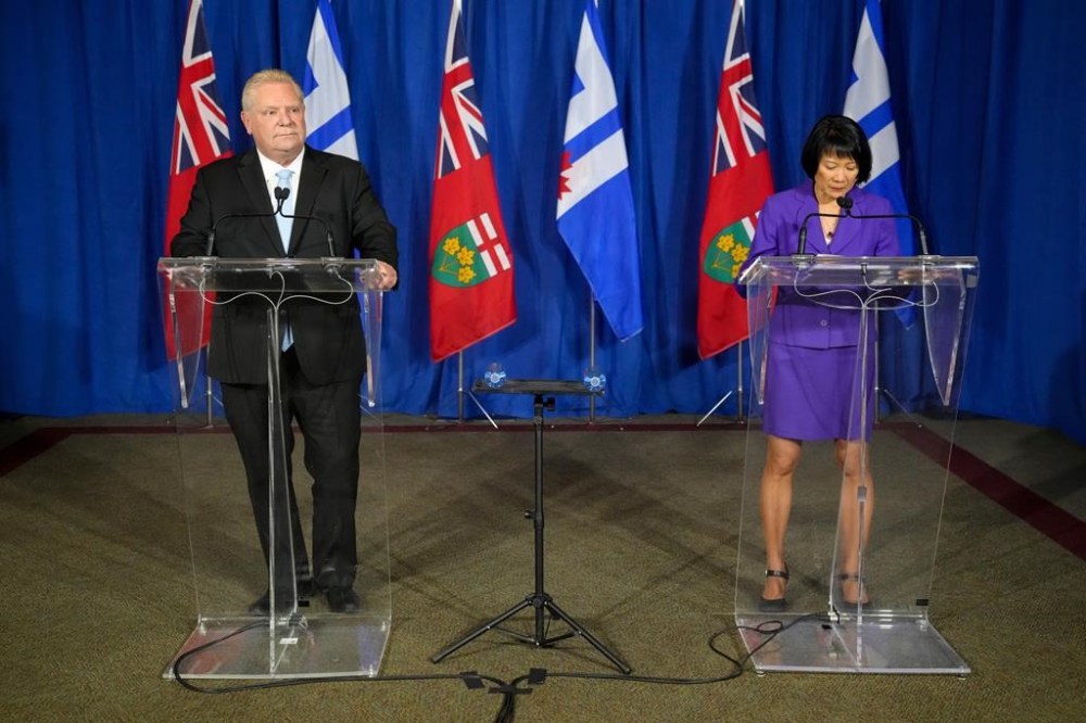 Ontario Premier Doug Ford and Toronto Mayor Olivia Chow hold a news conference in Toronto on Monday Nov. 27, 2023. Ford says the province will upload two Toronto highways in order to help alleviate the city's growing financial pressures. THE CANADIAN PRESS/Chris Young