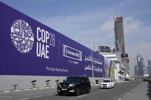 Cars pass by a billboard advertising COP28 at Sheikh Zayed highway in Dubai, United Arab Emirates, Monday, Nov. 27, 2023. Canada’s image at the world’s signature climate negotiations could be complicated by infighting, some observers fear, as two of the federal government’s ardent critics at the provincial level look to capture attention at the United Nations climate summit known as COP28.THE CANADIAN PRESS/AP-Kamran Jebreili