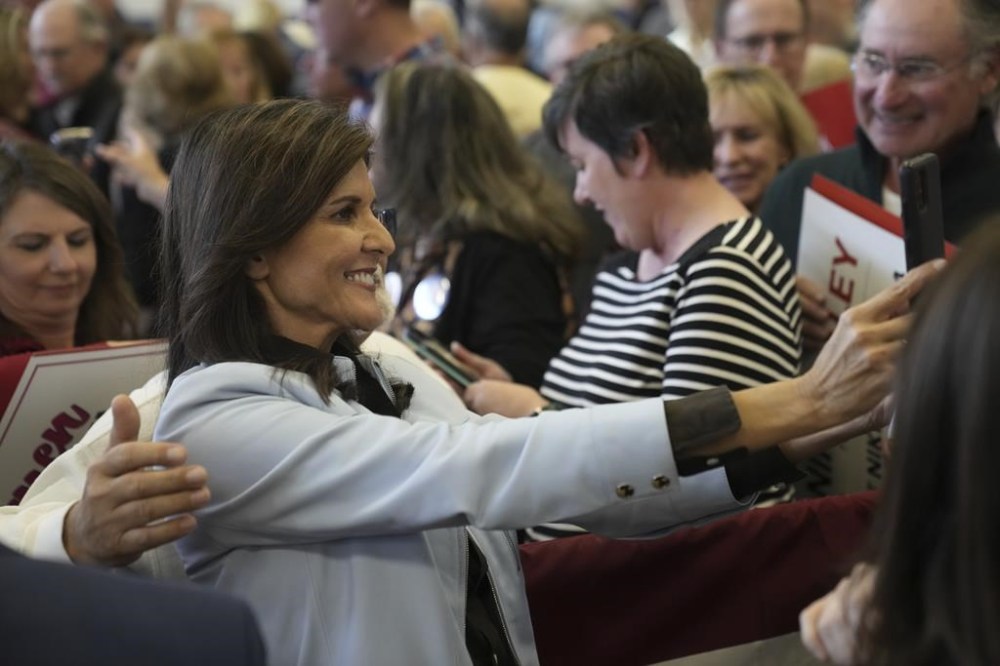 GOP presidential hopeful Nikki Haley takes selfies with supporters after a campaign event on Monday, Nov. 27, 2023, in Bluffton, S.C. Haley is among a cluster of Republican candidates competing for second place in a GOP Republican primary thus far largely dominated by former President Donald Trump. (AP Photo/Meg Kinnard)
