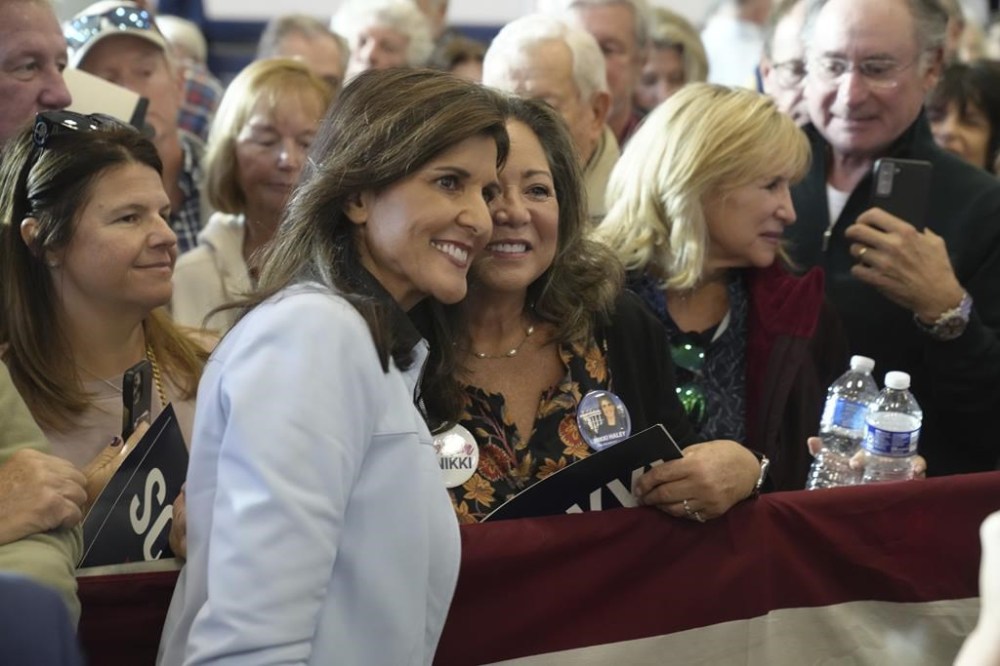 GOP presidential hopeful Nikki Haley takes selfies with supporters after a campaign event on Monday, Nov. 27, 2023, in Bluffton, S.C. Haley is among a cluster of Republican candidates competing for second place in a GOP Republican primary thus far largely dominated by former President Donald Trump. (AP Photo/Meg Kinnard)