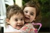 This undated photo released by Hostages and Missing Families Forum Headquarters shows twin sisters, Emma Aloni Cunio and Yuli Aloni Cunio, 3 years-old, released Monday, Nov. 27, 2023, to Israel after 52 days in Hamas captivity. Their mother Sharon Aloni Cunio, 34, who was also released today is the personal advisor for the Head of Ashkol Regional Council. Her husband, David, and his brother Ariel remain in Hamas captivity. (Hostages and Missing Families Forum headquarters via AP)