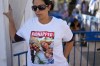 FILE - Ofri Bibas Levy wears a shirt with her brother, sister-in-law and their two children, Kfir and Ariel, held captive in Gaza, in Tel Aviv, Israel, on Nov. 21, 2023. Kfir Bibas has spent nearly a fifth of his life in Hamas captivity. The 10-month-old was abducted from his home in a southern Israeli kibbutz on Oct. 7, when Palestinian militants snatched about 240 people and dragged them to Gaza. (AP Photo/Ariel Schalit, File)