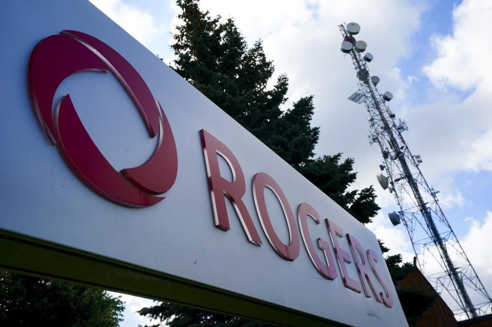 Telecommunications company Rogers Communications signage is pictured in Ottawa on Tuesday, July 12, 2022.
Rogers Communications Inc. says online streaming giants should be forced to contribute two per cent of annual Canadian revenues to support Canadian and Indigenous content. THE CANADIAN PRESS/Sean Kilpatrick