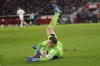 Bayern's goalkeeper Manuel Neuer saves during the German Bundesliga soccer match between 1.FC Cologne and Bayern Munich in Cologne, Germany, Friday, Nov. 24, 2023. (AP Photo/Martin Meissner)