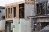 A contractor carries a ladder into a residential construction site in a suburb of Halifax on Tuesday, Nov. 28, 2023. THE CANADIAN PRESS/Darren Calabrese