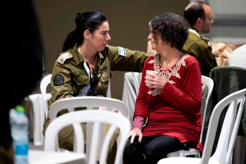 This handout photo provided by the Israel Prime Minister Office shows Shoshan Haran, right, upon her arrival in Israel after being freed. Shoshan was one of the 13 Israeli hostages that Hamas released late Saturday, Nov. 25, 2023, in the second round of swaps under a cease-fire deal. (Israel Prime Minister Office/Handout via AP)