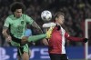 Feyenoord's Ayase Ueda, right, challenges Atletico Madrid's Axel Witsel during the Champions League, Group E soccer match between Feyenoord and Atletico Madrid at the Feyenoord stadium, in Rotterdam, Netherlands, Tuesday, Nov. 28, 2023. (AP Photo/Patrick Post)