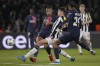 Newcastle's Lewis Milley, centre, challenges for the ball with PSG's Bradley Barcola, right, and PSG's Kylian Mbappe during the Champions League group F soccer match between Paris Saint-Germain and Newcastle United FC at the Parc des Princes in Paris, Tuesday, Nov. 28, 2023. (AP Photo/Thibault Camus)