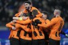 Shakhtar players celebrate after teammate Mykola Matviyenko scored the opening goal during the Champions League group H soccer match between Shakhtar Donetsk and Antwerp at Volksparkstadion in Hamburg, Germany, Tuesday, Nov. 28, 2023. Shakhtar won 1-0. (AP Photo/Martin Meissner)