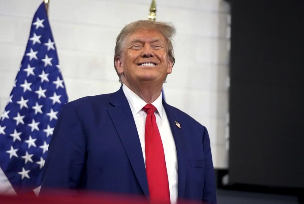 FILE - Republican presidential candidate and former President Donald Trump speaks during a rally Nov. 18, 2023, in Fort Dodge, Iowa. Trump's lawyers have suggested their strategy in his election interference case in Washington involves distancing their client from the horde of U.S. Capitol rioters, whom the former president has embraced on the campaign trail.(AP Photo/Bryon Houlgrave, File)