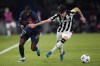 Newcastle's Tino Livramento fends off PSG's Ousmane Dembele, right, during the Champions League group F soccer match between Paris Saint-Germain and Newcastle United FC at the Parc des Princes in Paris, Tuesday, Nov. 28, 2023. (AP Photo/Christophe Ena)