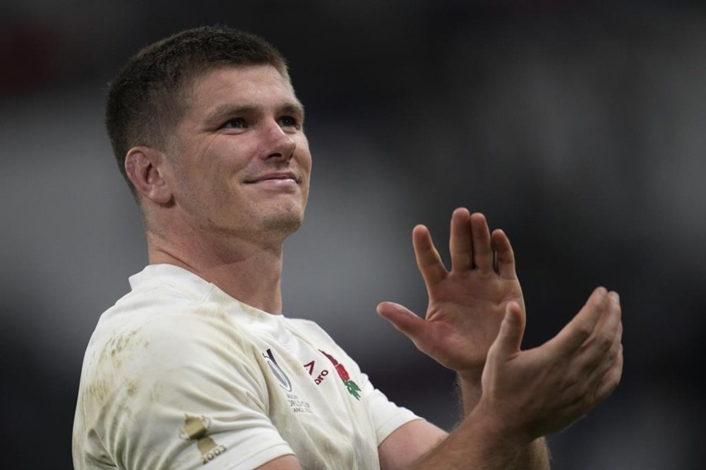 FILE - England's Owen Farrell applauds after the Rugby World Cup quarterfinal match between England and Fiji at the Stade de Marseille in Marseille, France, on Oct. 15, 2023. England rugby captain Owen Farrell is taking a break from the national team and will miss next year's six nations tournament to