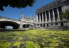 A bloom of algae covers the waters of the Rideau Canal near the Senate of Canada Building and the Chateau Laurier, in Ottawa, on Sunday, June 21, 2020. An Ontario Conservative MP says senators should 