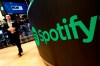 Audio streaming platform Spotify says that requiring it to make a contribution aimed at supporting the Canadian broadcasting sector could force the company to cut its existing investments in order to maintain its financial viability. A trading post sports the Spotify logo on the floor of the New York Stock Exchange, Tuesday, April 3, 2018.THE CANADIAN PRESS/AP-Richard Drew
