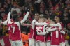 Arsenal's Kai Havertz celebrates with teammates after scoring his side's opening goal during the Champions League Group B soccer match between Arsenal and Lens, at Emirates stadium, in London, Wednesday, Nov. 29, 2023. (AP Photo/Kin Cheung)