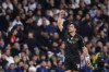 Napoli's Giovanni Simeone celebrates after scoring the opening goal during the Champions League Group C soccer match between Real Madrid and Napoli at the Santiago Bernabeu stadium in Madrid, Spain, Wednesday, Nov. 29, 2023. (AP Photo/Manu Fernandez)