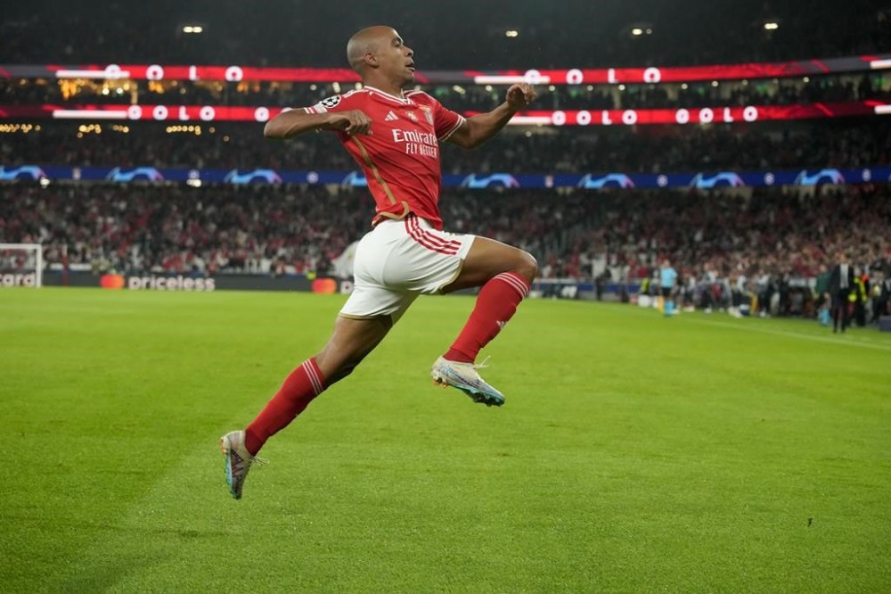 Benfica's Joao Mario celebrates after he scored his side's first goal during the Champions League group D soccer match between SL Benfica and Inter Milano at the Luz stadium in Lisbon, Wednesday, Nov. 29, 2023. (AP Photo/Armando Franca)