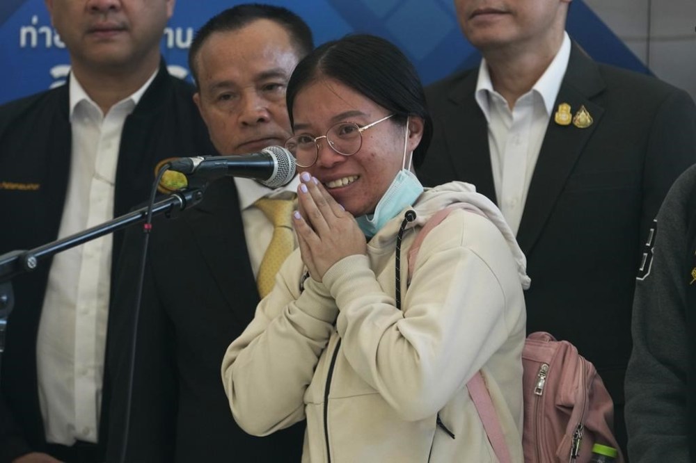 Nutthawaree Munkan, a Thai hostage who was freed from Hamas, talks to reporters after arriving at Suvarnabhumi International Airport in Samut Prakarn Province, Thailand, Thursday, Nov. 30, 2023. Twenty-three Thai hostages kidnapped by Hamas in its Oct. 7, 2023 attack on southern Israel have been freed so far, and Thailand's foreign ministry says nine remain in captivity in Gaza. There were about 30,000 Thai overseas workers in Israel, mostly in the agricultural sector, but more than 8,000 have returned home since the attack. (AP Photo/Sakchai Lalit)