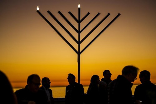 FILE - People gather around the 10-foot menorah during the 
