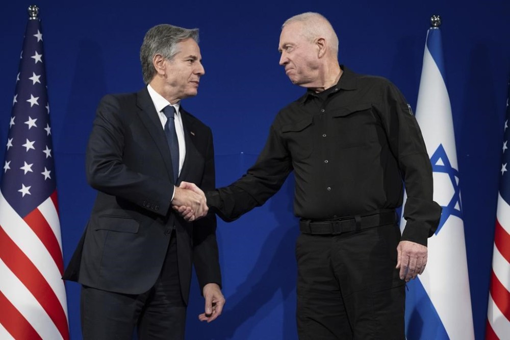 Israeli Defence Minister Yoav Gallant, right, and US Secretary of State Antony Blinken shake hands prior to a meeting in Tel Aviv, Israel, Thursday, Nov. 30, 2023. Blinken told Israeli leaders on November 30 that a temporary truce in their war with Hamas was