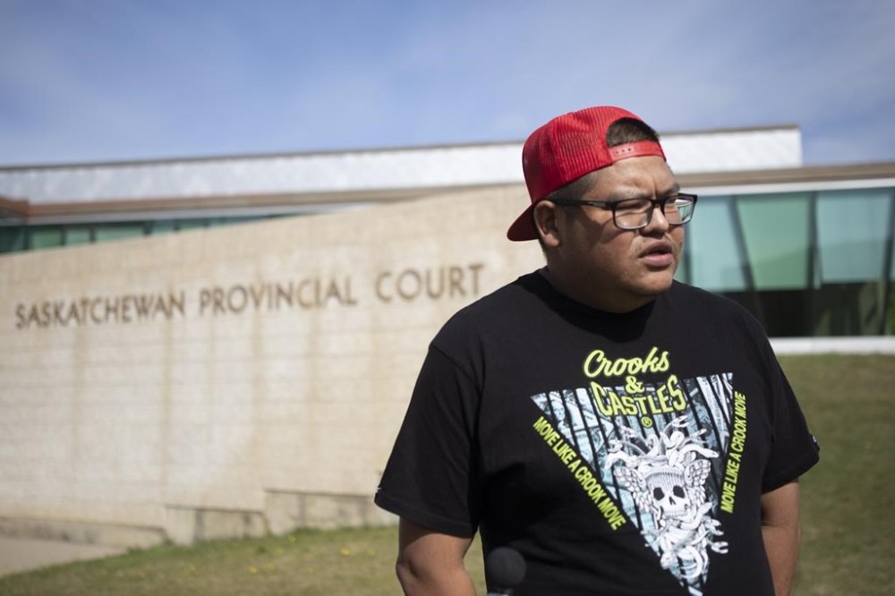 Brett Herman, brother of Braden Herman, speaks to the media outside the Saskatchewan Provincial Courthouse in Prince Albert, Sask., on Thursday, May 13, 2021. THE CANADIAN PRESS/Kayle Neis