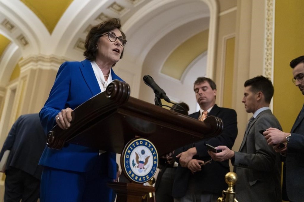 FILE - Sen. Jacky Rosen, D-Nev., speaks to media after a Senate Democratic policy luncheon, Oct. 17, 2023, on Capitol Hill in Washington. A federal grand jury has indicted a Las Vegas man arrested last month on suspicion of making antisemitic threats against Rosen and her family, along with the family of another U.S. senator, according to court records. (AP Photo/Stephanie Scarbrough, File)