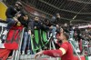 Italy's goalkeeper Gianluigi Donnarumma celebrates with supporters after the Euro 2024 group C qualifying soccer match between Ukraine and Italy at the BayArena in Leverkusen, Germany, Monday, Nov. 20, 2023. (AP Photo/Martin Meissner)